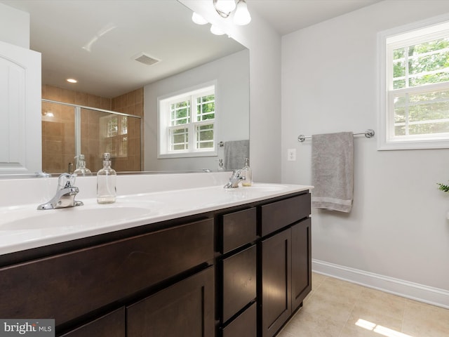 933 Winding Rd, Edgewater, MD 21037 - full bathroom featuring double vanity, a stall shower, tile patterned floors, and baseboards