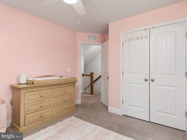 933 Winding Rd, Edgewater, MD 21037 - bedroom with light colored carpet, a closet, ceiling fan, and baseboards