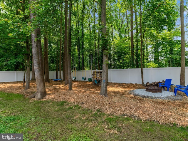 933 Winding Rd, Edgewater, MD 21037 - view of yard with an outdoor fire pit