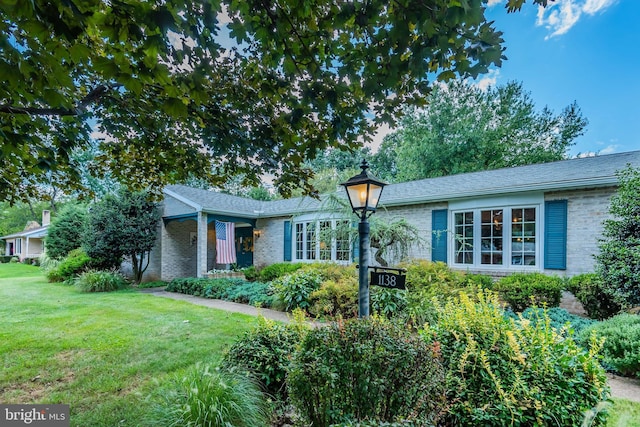 1138 Maple St, Carlisle, PA 17013 - view of front of property with brick siding and a front lawn