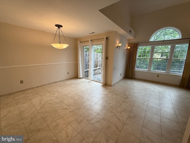 15 E Park Rd, Newtown, PA 18940 - tiled empty room with healthy amount of natural light and baseboards