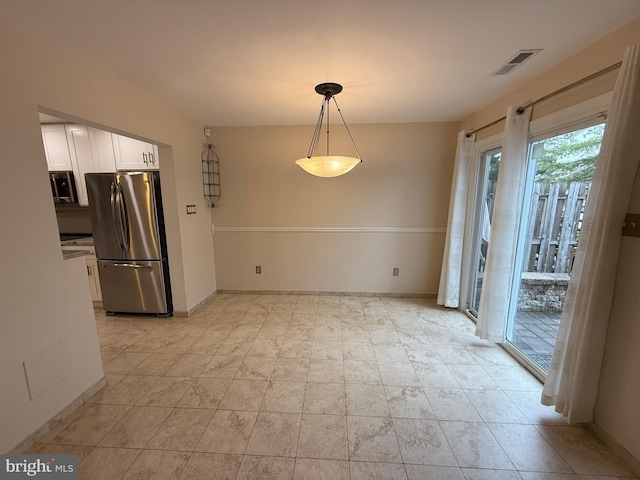 15 E Park Rd, Newtown, PA 18940 - unfurnished dining area with baseboards