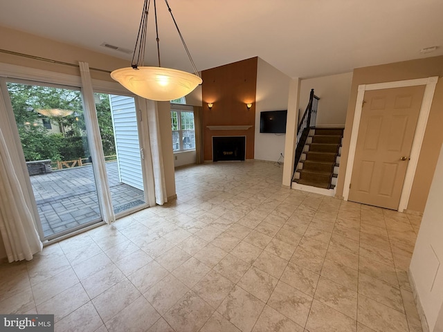 15 E Park Rd, Newtown, PA 18940 - unfurnished living room featuring a fireplace and stairs