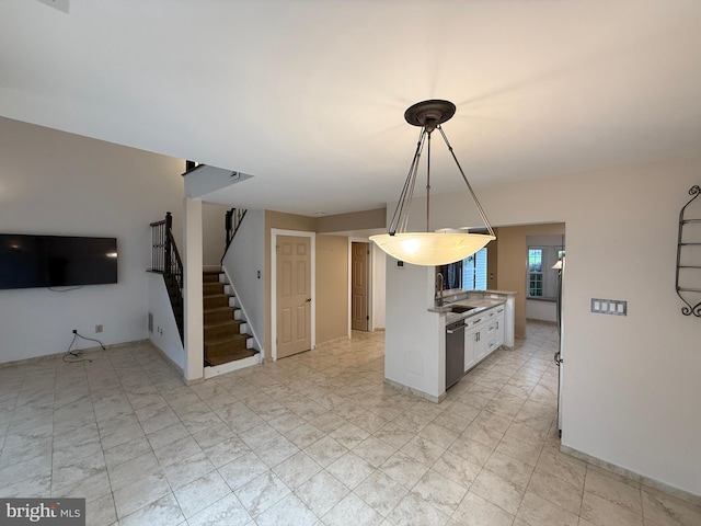 15 E Park Rd, Newtown, PA 18940 - kitchen featuring stainless steel dishwasher, freestanding refrigerator, a sink, decorative light fixtures, and white cabinets