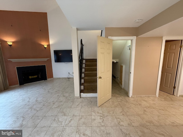 15 E Park Rd, Newtown, PA 18940 - unfurnished living room featuring a fireplace and stairs