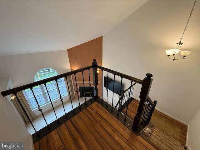 15 E Park Rd, Newtown, PA 18940 - stairway with a chandelier, wood finished floors, baseboards, and high vaulted ceiling