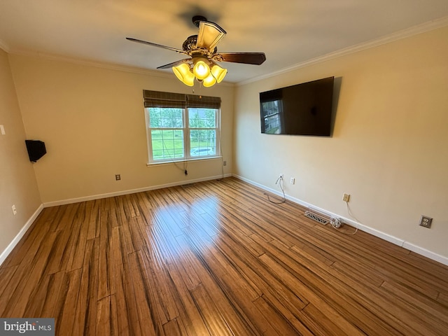 15 E Park Rd, Newtown, PA 18940 - empty room with crown molding, baseboards, wood finished floors, and ceiling fan