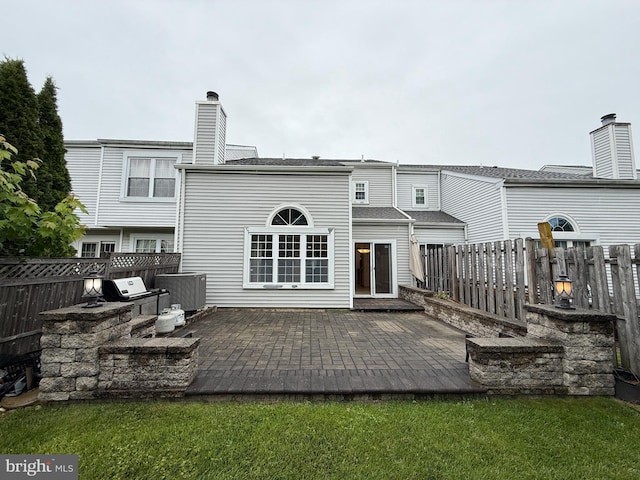 15 E Park Rd, Newtown, PA 18940 - rear view of house featuring an outdoor kitchen, a fenced backyard, and a patio