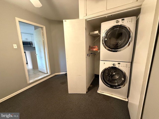 15 E Park Rd, Newtown, PA 18940 - laundry area with stacked washer / dryer, carpet floors, and baseboards