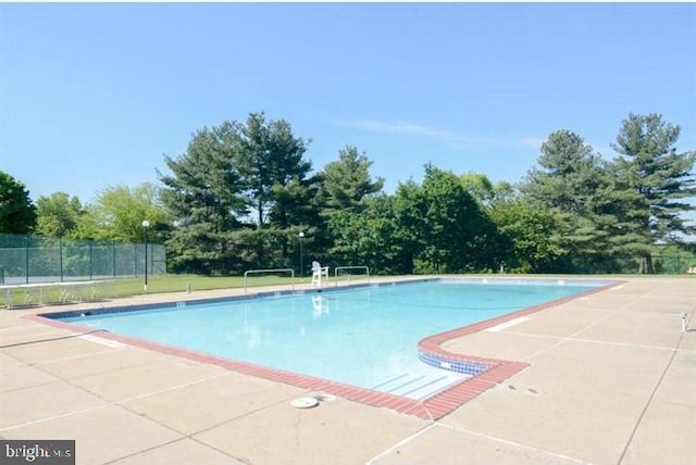 15 E Park Rd, Newtown, PA 18940 - view of swimming pool with a patio area and view of wooded area