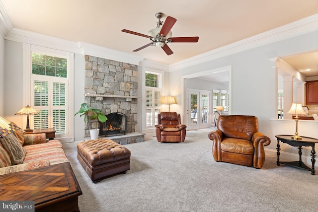 4729 Grand Masters Way, Woodbridge, VA 22192 - carpeted living area featuring ornamental molding, ceiling fan, and a stone fireplace