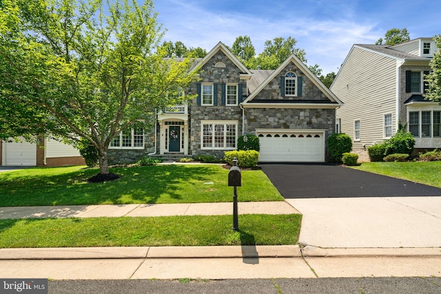 4729 Grand Masters Way, Woodbridge, VA 22192 - traditional home featuring stone siding, driveway, and a front lawn