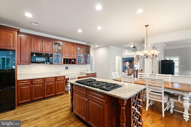 4729 Grand Masters Way, Woodbridge, VA 22192 - kitchen featuring black appliances, a center island, light wood finished floors, glass insert cabinets, and recessed lighting
