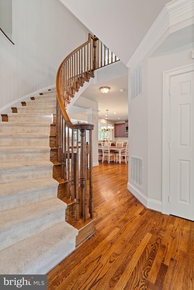 4729 Grand Masters Way, Woodbridge, VA 22192 - stairway with wood finished floors and a chandelier