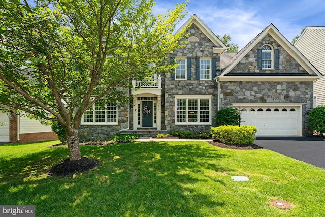 4729 Grand Masters Way, Woodbridge, VA 22192 - view of front of property featuring stone siding, asphalt driveway, a garage, and a front yard