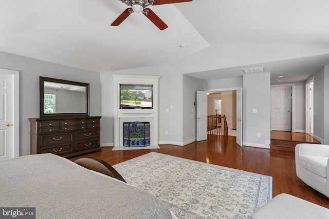 4729 Grand Masters Way, Woodbridge, VA 22192 - bedroom featuring lofted ceiling, dark wood-type flooring, a premium fireplace, and ceiling fan