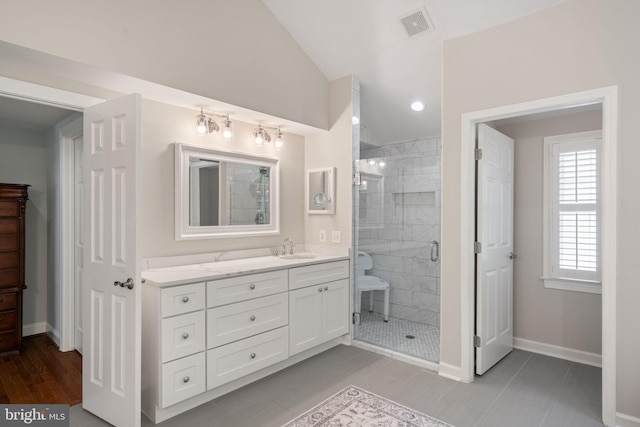 4729 Grand Masters Way, Woodbridge, VA 22192 - full bathroom featuring vanity, a shower stall, vaulted ceiling, and tile patterned floors