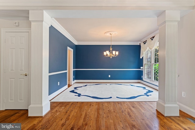 4729 Grand Masters Way, Woodbridge, VA 22192 - unfurnished dining area featuring decorative columns, wood finished floors, ornamental molding, and a chandelier