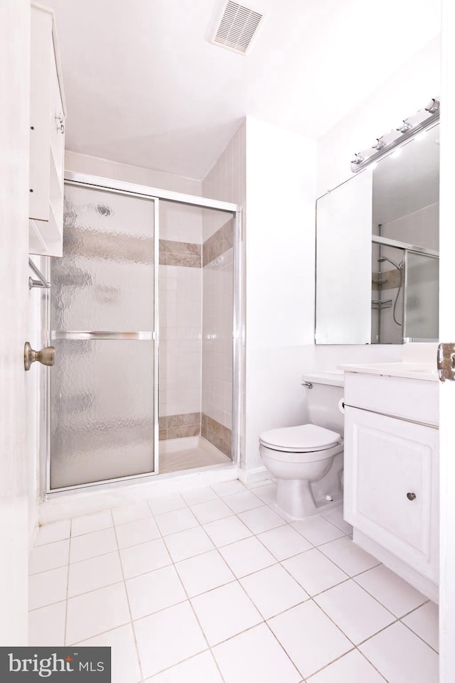 14520 Sorrento Ct, Burtonsville, MD 20866 - bathroom featuring vanity, toilet, a shower stall, and tile patterned flooring