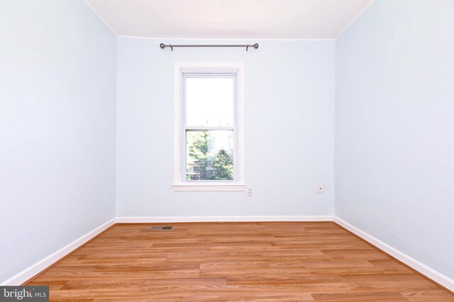 14520 Sorrento Ct, Burtonsville, MD 20866 - unfurnished room featuring light wood-style flooring, crown molding, and baseboards