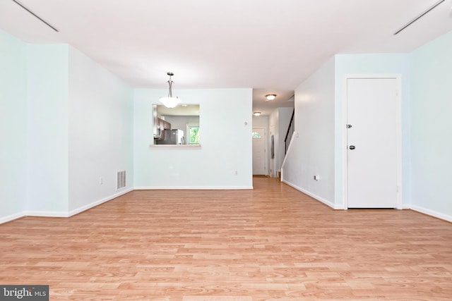 14520 Sorrento Ct, Burtonsville, MD 20866 - unfurnished living room with light wood-type flooring and baseboards