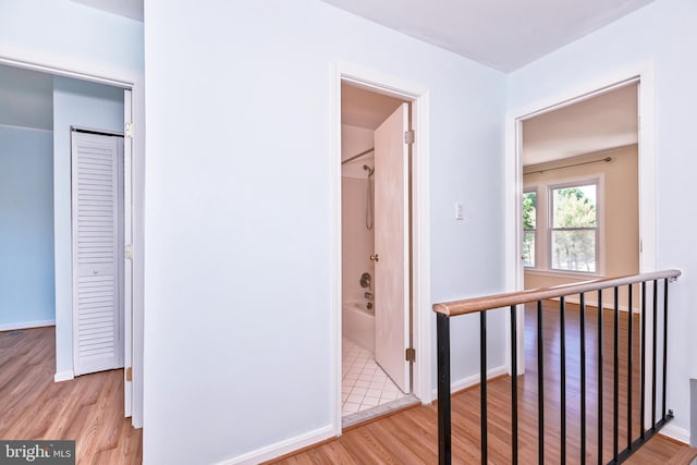 14520 Sorrento Ct, Burtonsville, MD 20866 - hallway with light wood-style flooring, an upstairs landing, and baseboards