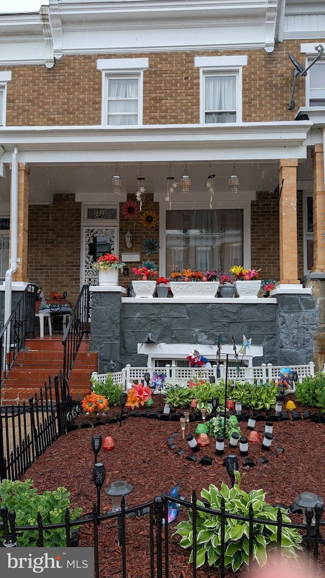 2828 Pelham Ave, Baltimore, MD 21213 - view of exterior entry with brick siding and covered porch