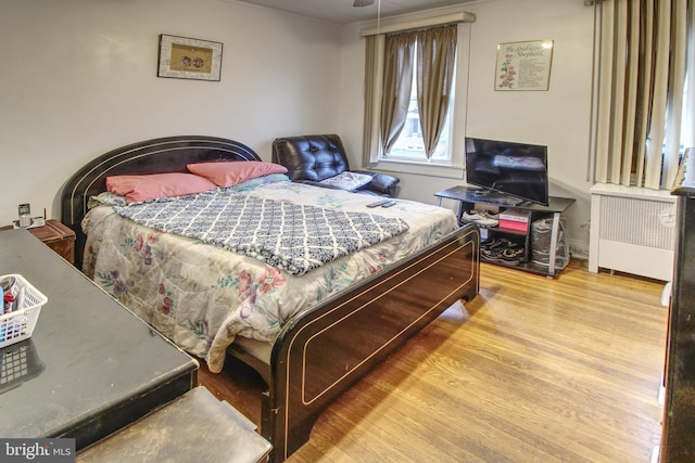 2828 Pelham Ave, Baltimore, MD 21213 - bedroom with radiator and wood finished floors