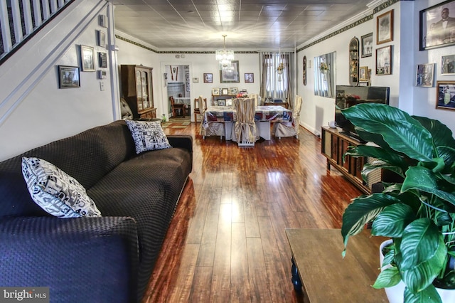 2828 Pelham Ave, Baltimore, MD 21213 - living room featuring a chandelier, ornamental molding, and hardwood / wood-style flooring