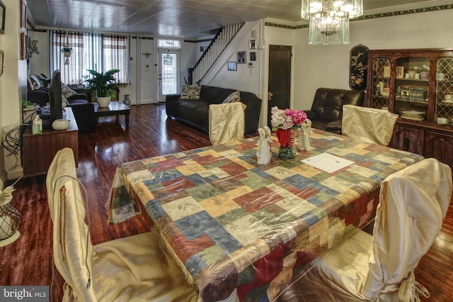 2828 Pelham Ave, Baltimore, MD 21213 - dining area featuring wood finished floors, stairs, ornamental molding, and a chandelier