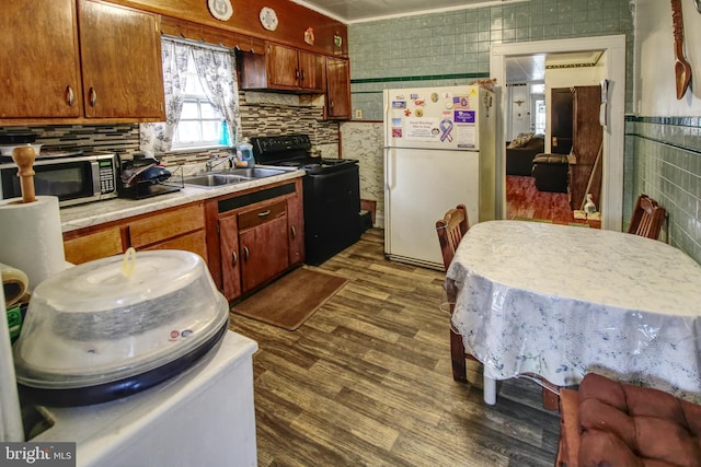 2828 Pelham Ave, Baltimore, MD 21213 - kitchen featuring freestanding refrigerator, stainless steel microwave, electric range, a sink, and light countertops