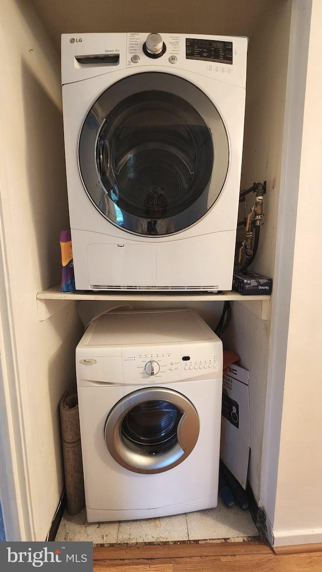 2921 N Leisure World Blvd Unit 418, Silver Spring, MD 20906 - washroom with stacked washer and clothes dryer and baseboards