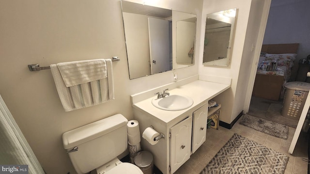 2921 N Leisure World Blvd Unit 418, Silver Spring, MD 20906 - bathroom featuring toilet, vanity, tile patterned floors, and baseboards