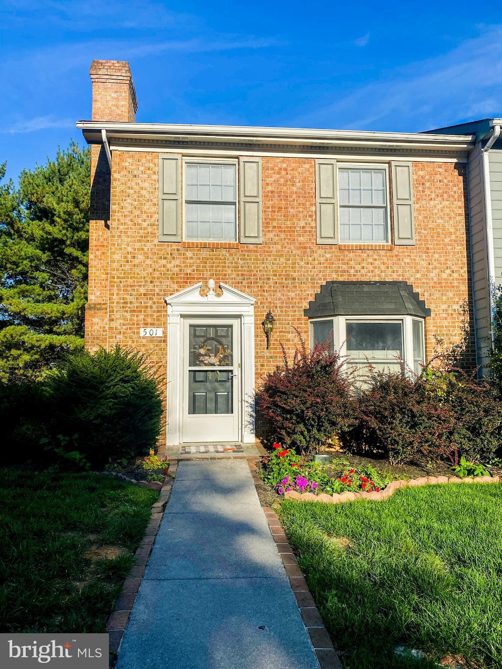 501 Tudor Dr, Winchester, VA 22603 - view of front of home with a chimney and brick siding