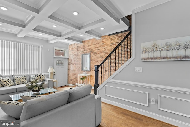 1330 Aisquith St, Baltimore, MD 21202 - living room with brick wall, stairs, beamed ceiling, light wood-style floors, and recessed lighting