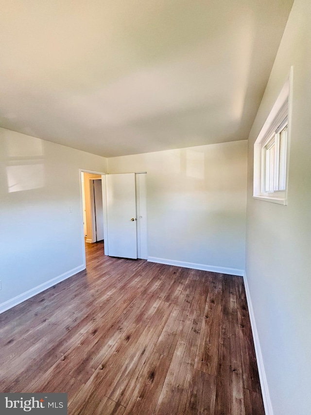 13015 Estelle Rd, Silver Spring, MD 20906 - unfurnished bedroom featuring hardwood / wood-style flooring and baseboards