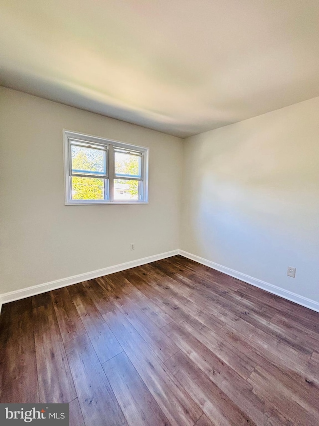 13015 Estelle Rd, Silver Spring, MD 20906 - spare room featuring dark wood-type flooring and baseboards
