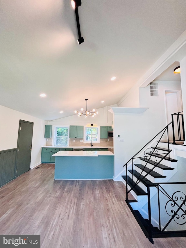 13015 Estelle Rd, Silver Spring, MD 20906 - kitchen featuring a chandelier, green cabinets, light countertops, wood finished floors, and lofted ceiling