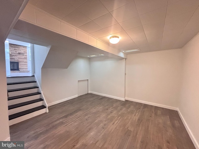 13015 Estelle Rd, Silver Spring, MD 20906 - finished below grade area with dark wood-style flooring, baseboards, and stairway