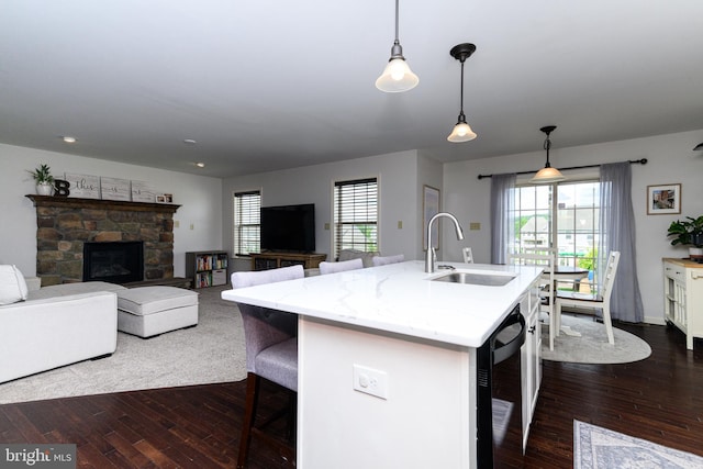 24 Furlong Rd, Douglassville, PA 19518 - kitchen featuring a sink, dark wood-style floors, a breakfast bar, hanging light fixtures, and a kitchen island with sink