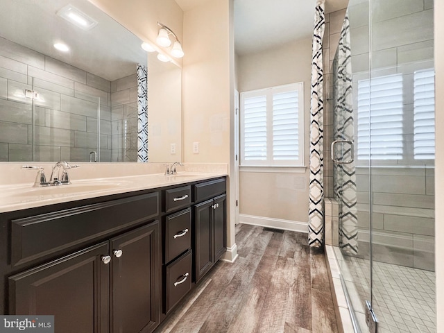 22543 Bradbury Way, Georgetown, DE 19947 - full bathroom featuring double vanity, wood finished floors, and baseboards