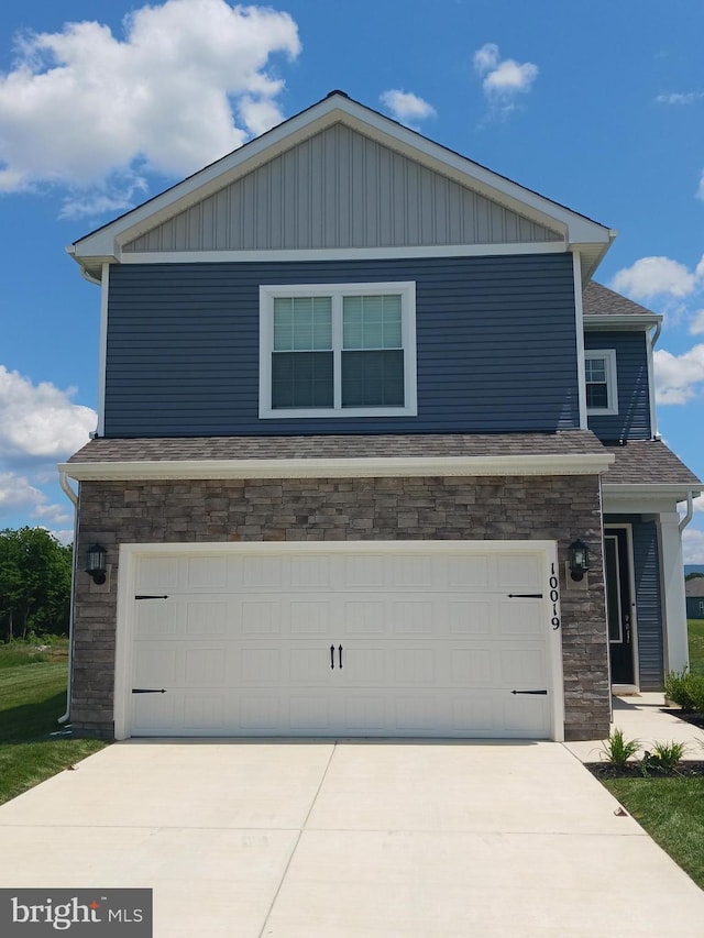 10019 Maids Fancy Way, Hagerstown, MD 21740 - view of front facade featuring stone siding, driveway, and an attached garage