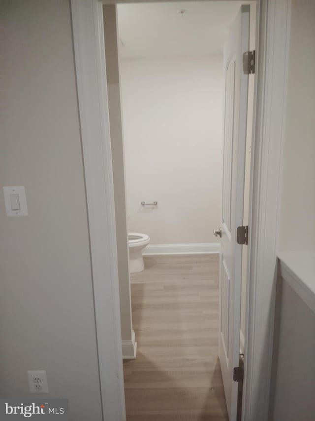 10019 Maids Fancy Way, Hagerstown, MD 21740 - bathroom with toilet, wood finished floors, and baseboards