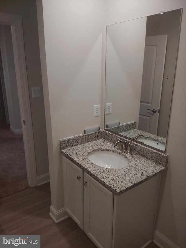 10019 Maids Fancy Way, Hagerstown, MD 21740 - bathroom with vanity, wood finished floors, and baseboards