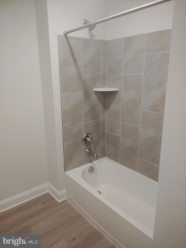 10019 Maids Fancy Way, Hagerstown, MD 21740 - bathroom featuring  shower combination, wood finished floors, and baseboards