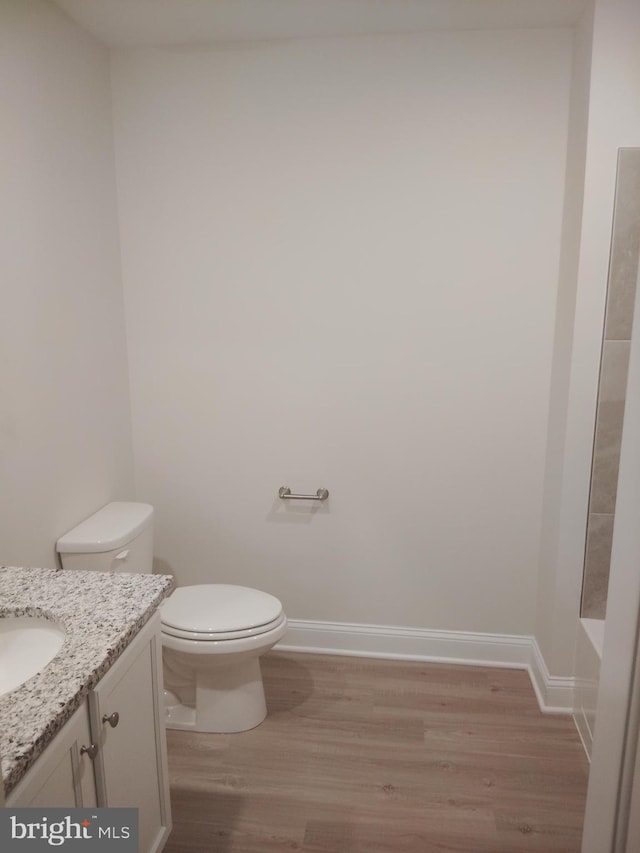 10019 Maids Fancy Way, Hagerstown, MD 21740 - full bathroom with vanity, toilet, wood finished floors, and baseboards