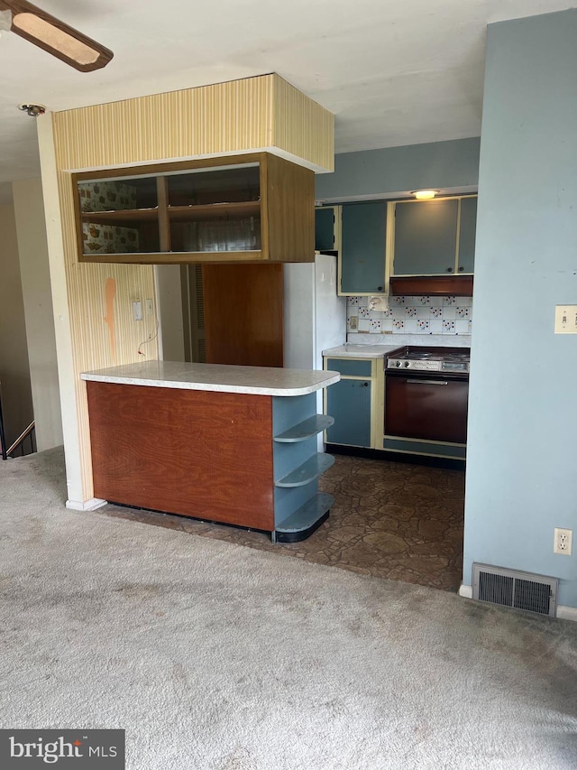 5933 Rawley Pike, Rockingham, VA 22801 - kitchen featuring open shelves, dark carpet, dishwasher, light countertops, and freestanding refrigerator