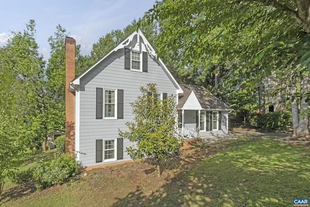 676 Victorian Ct, Charlottesville, VA 22901 - view of side of property featuring a chimney, covered porch, and a yard
