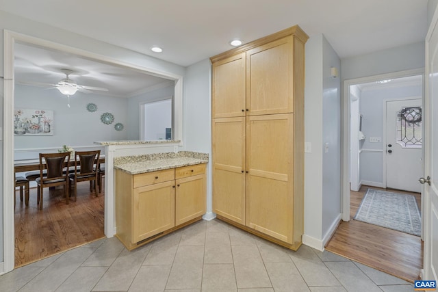 676 Victorian Ct, Charlottesville, VA 22901 - kitchen featuring light brown cabinets, light tile patterned flooring, a peninsula, light stone counters, and recessed lighting