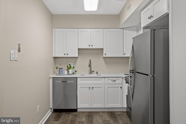 411 N Stiles Ave Unit A5, Maple Shade, NJ 08052 - kitchen with stainless steel appliances, white cabinetry, light countertops, and dark wood-style flooring